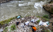 A small group of volunteers worked to clean up styrofoam from the Ciliwung River in Bogor,...