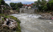 A small group of volunteers worked to clean up styrofoam from the Ciliwung River in Bogor,...