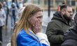 A young woman cries as she witnesses the ambulance. Ambulance hit by Russian attack in Kha...