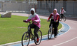 Palestinian women ride bicycles at Gaza City's Yarmouk Stadium on March 7, 2023 a day befo...