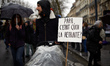 A protester walks with a baby and a placrd reading 'Dad, was what pension ?' France's labo...