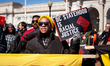 People line up to march to the Capitol during a protest against Congress’s likely vote to...
