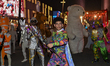Artists perform global street art performances as part of the three-day Darb Lusail Parade...