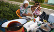 Mrs. Rosana prepares the dough with cowpea to prepare a typical Acaraje in Morro de Sao Pa...