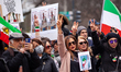 People sing "Baraye" during a protest against the Islamic regime of Iran, part of a day of...