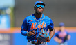 New York Mets Ronny Mauricio (60) comes off field during the fourth inning of a baseball g...