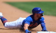 New York Mets Danny Mendick (15) slides into 3B during the fourth inning of a baseball gam...