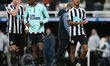 Newcastle United's Sven Botman (L), Alexander Isak (m) and Joe Willock (r) applaud the fan...