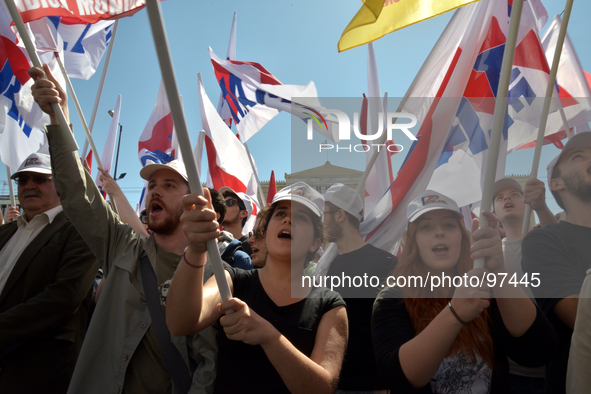 Protesters commemorate International Workers Day in front of the Greek Parliament in central Athens, on May 1, 2014. 