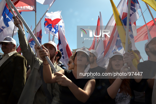 Protesters commemorate International Workers Day in front of the Greek Parliament in central Athens, on May 1, 2014. 