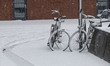 Bicycles covered by snow. Blizzard hits the Netherlands and Belgium during a low temperatu...