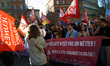 The banner reads 'Precarity is not a job'. France's labour unions and left parties led a 8...
