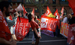 A young woman reacts during the protest. France's labour unions and left parties led a 8th...