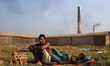 Brickyard workers are taking rest after work.The world is going through a speedy urbaniza...