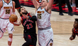 Nikola Jokic #15 of the Denver Nuggets tries to block Fred VanVleet #23 of the Toronto Rap...