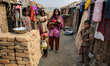 Child marriage also very common among brick yard workers. ROJINA is a young mother holding...