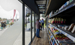 Customers pick up grocery items after opening Qatars first fully autonomous and checkout-f...