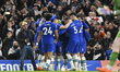Chelsea players celebrating the team's first goal during the Premier League match between...