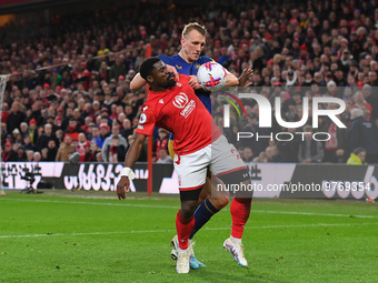 Surge Aurier of Nottingham Forest battles with Dan Burn of Newcastle United during the Premier League match between Nottingham Forest and Ne...