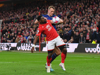 Surge Aurier of Nottingham Forest battles with Dan Burn of Newcastle United during the Premier League match between Nottingham Forest and Ne...