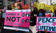 Demonstrators march in Washington, D.C. on March 18, 2023 during an anti-war protest organ...