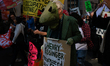 Demonstrators march in Washington, D.C. on March 18, 2023 during an anti-war protest organ...