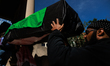 Demonstrators carry symbolic body caskets into The New York Avenue Presbyterian Church dur...