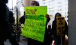 Demonstrators walk into The New York Avenue Presbyterian Church to listen to people speak...