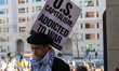 Demonstrators walk into The New York Avenue Presbyterian Church to listen to people speak...