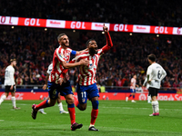Thomas Lemar and Koke celebrates a goal during La Liga match between Atletico de Madrid and Valencia CF at Civitas Metropolitano on March 18...