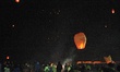 People fly Kongming lanterns, or small hot-air paper balloons, to celebrate the upcoming 2...