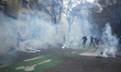 Protesters run amid clouds of tear gas. Scuffles happened between protesters and riot poli...