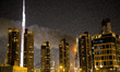 Flames rip through the Address Downtown hotel after it was hit by a massive fire, near the...
