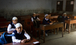 Students are waiting inside class for teacher to come and distribute new books in Dhaka, B...