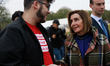 Former speaker of the U.S. House of Representatives Nancy Pelosi speaks with a demonstrato...