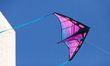 A colorful kite flies near the Washington Monument, during a kite event at the annual Cher...