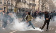

Demonstrators are kicking away tear gas pebbles thrown by police as clashes break out al...