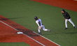 Cincinnati infielder, Kameron Guidry, is seen rounding first base during a college basebal...
