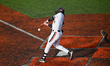 Cincinnati infielder, Kameron Guidry, is seen hitting the ball during a college baseball g...