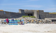 Daily life at the sea during a blue sky day at Pembroke beach with many locals and tourist...