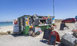 Daily life at the sea during a blue sky day at Pembroke beach with many locals and tourist...