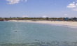Daily life at the sea during a blue sky day at Pembroke beach with many locals and tourist...