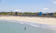Daily life at the sea during a blue sky day at Pembroke beach with many locals and tourist...