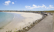 Daily life at the sea during a blue sky day at Pembroke beach with many locals and tourist...