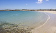 Daily life at the sea during a blue sky day at Pembroke beach with many locals and tourist...
