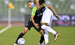 Shojae Khalilzadeh (R) of Al Ahli SC and Yacine Bammou (L) of Al Shamal SC battle for the...