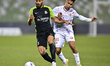 Shojae Khalilzadeh (L) of Al Ahli SC and Omar Mohamed (R) of Al Shamal SC battle for the b...