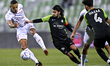 Ali Ahmad Ghaderi (C)  of Al Ahli SC and Yacine Bammou (L) of Al Shamal SC battle for the...