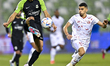 Shojae Khalilzadeh (L) of Al Ahli SC and Rabeh Yahia Boussafi (R) of Al Shamal SC battle f...