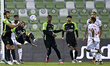 Ali Ahmad Ghaderi (2-L) of Al Ahli SC and Abdel Aziz Mitwali (R) of Al Shamal SC battle fo...